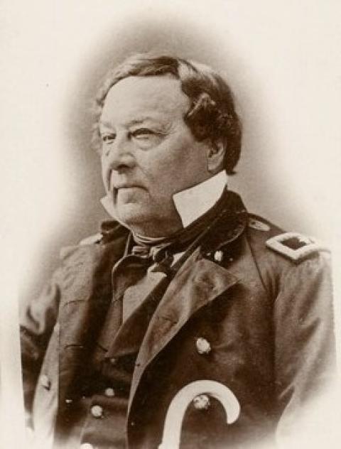 formal portrait of heavyset Caucasian man wearing glasses and military uniform