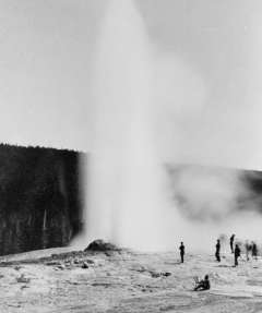 Even in 1883, Old Faithful drew crowds of tourists—and an artist at his easel—as well as the members of the president’s expedition. F. Jay Haynes photo, Library of Congress.